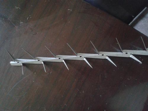 Wall spike strip
