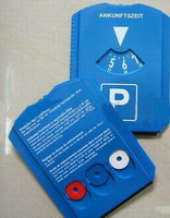 Parking disc with coin drawer on backside
