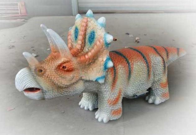 Artificial movable dinosaur rides mounts