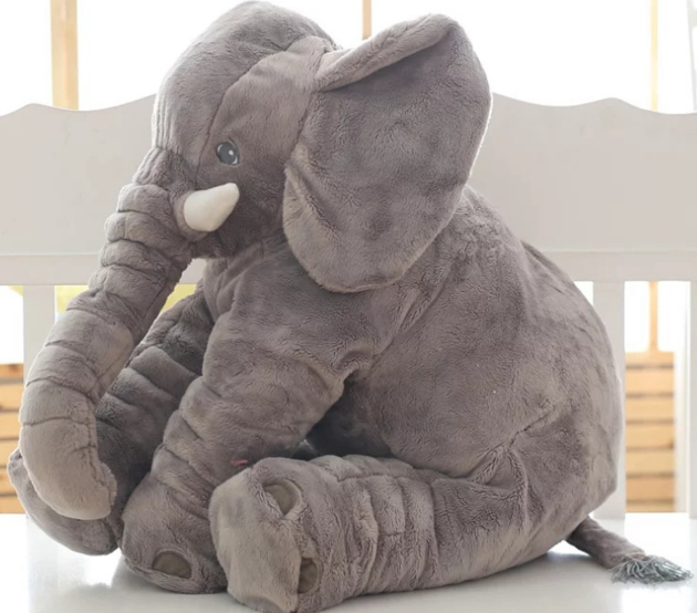 A pillow stuffed with a cartoon elephant cushion