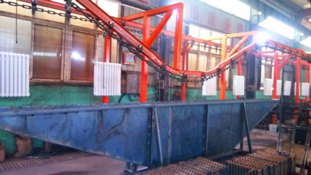 Generator powder coating line with chemical dipping pretreatment tanks