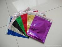 Colorized aluminized foil mailer