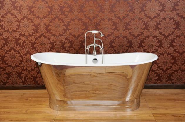 cast iron bathtub in a mirror polished stainless steel skirt