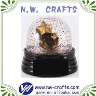 Glitter gold star water globe