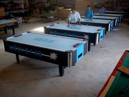 Air hockey table with coin machine