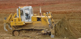 Tractor for land reclamation jobs with dozer and ripping equipment T-15.01M
