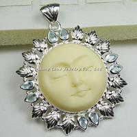 Silver carved bone pendant