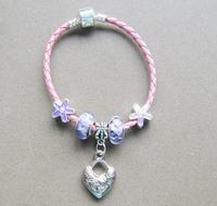 Leather cord bracelet with charms