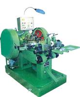 Sell button contact making machine